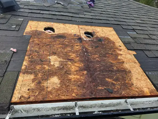 A roof repair in progress by the Leading Edge Roofing crew.